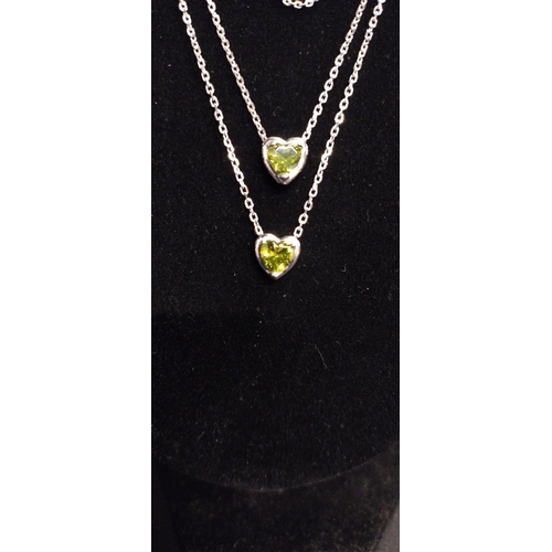 361 - Three sterling silver necklaces two with heart pendants with green glass central stone and plain cur... 