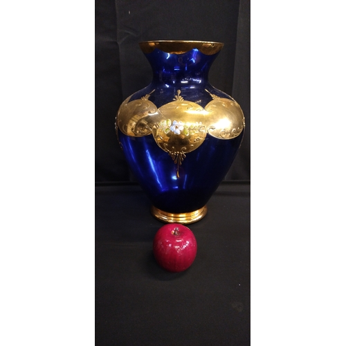 375 - Large Bohemian cobalt blue glass vase with floral and gold relief. Measures approx H 34.5 x W 24.5