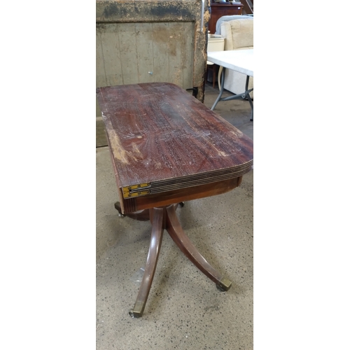 416 - Mahogany Half folding Pembroke table with brass casters. Measures approx 73 x 90.5 x 80.5 cm fully e... 