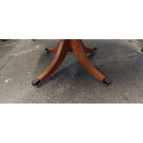 422 - Drop leaf oval  table with Lion claw feet and casters. Fully extended Measures approx 74.5 x W 154.5... 