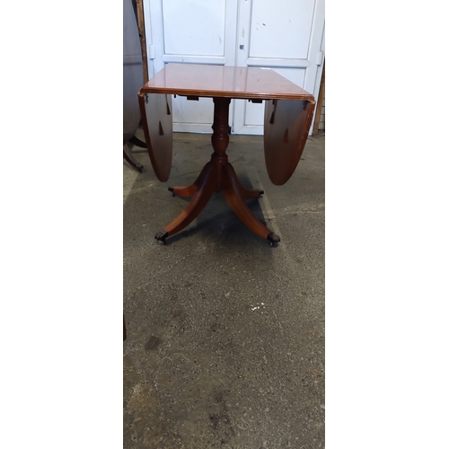 422 - Drop leaf oval  table with Lion claw feet and casters. Fully extended Measures approx 74.5 x W 154.5... 