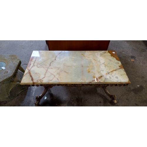 429 - Marble and brass coffee table. Measures approx H 48 x W 99 x D 50 cm. Collection only