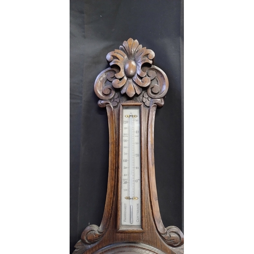 27 - Beautiful Early to Mid century solid oak Aneroid Barometer with carving. Measures approx H 92.5 x W ... 