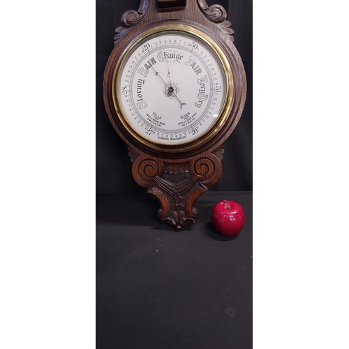 27 - Beautiful Early to Mid century solid oak Aneroid Barometer with carving. Measures approx H 92.5 x W ... 