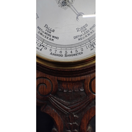 27 - Beautiful Early to Mid century solid oak Aneroid Barometer with carving. Measures approx H 92.5 x W ... 