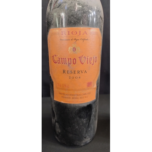 29 - Two bottles of unopened red wine.  2004 Campo viejo and 2005  Squinzano Rosso Riserva