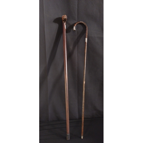 49 - Two wooden walking sticks one has hallmarked silver tip and stem pieces, one is a dark wood boxer do... 