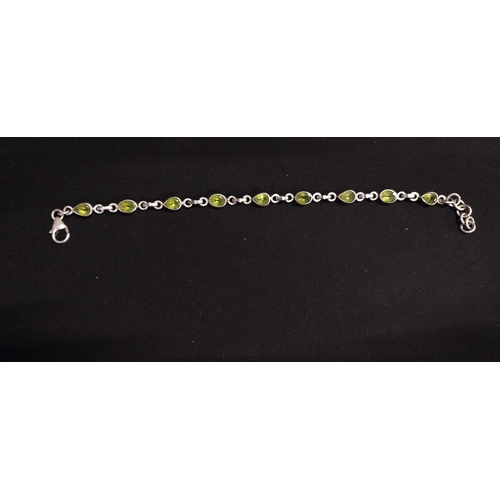 7 - Sterling silver bracelet set with 9 peridot stones