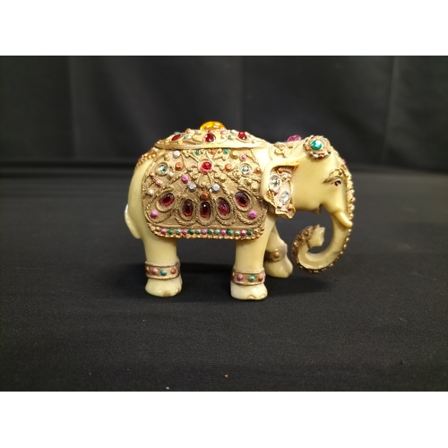 56 - Kaolinite Buddha and decorated resin elephant