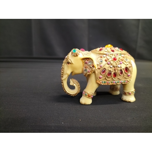 56 - Kaolinite Buddha and decorated resin elephant