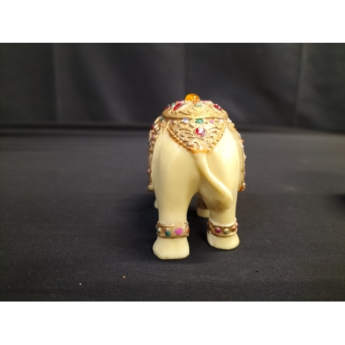 56 - Kaolinite Buddha and decorated resin elephant