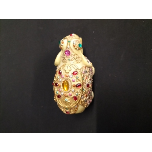 56 - Kaolinite Buddha and decorated resin elephant