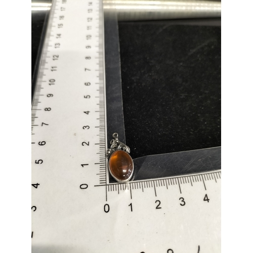 21 - Sterling silver and amber pendant measures approx 2.5 x 1 inch