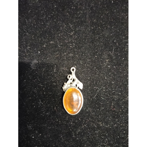 21 - Sterling silver and amber pendant measures approx 2.5 x 1 inch