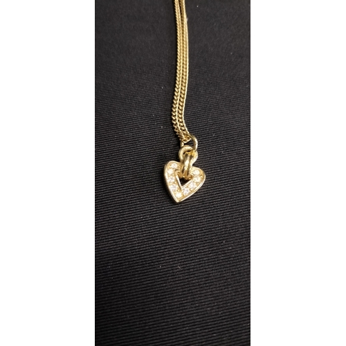 23 - Gold plated Christian Dior necklace and heart pendant