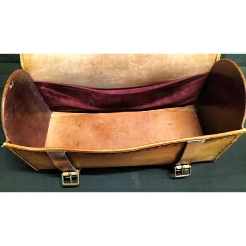 58 - Tan leather saddle bag with handle and buckle fastening.  dragon and scallop edging decoration measu... 