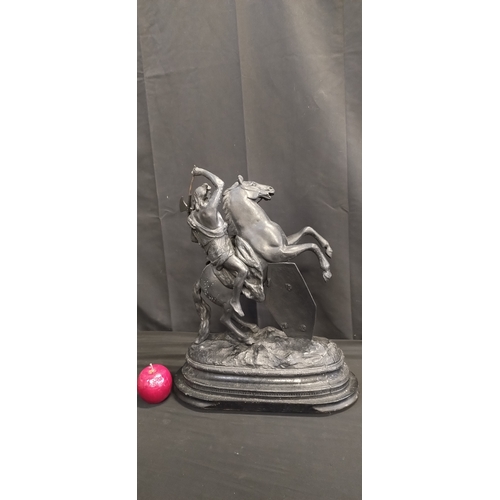 63 - Theodore Doriot.spelter Warrior on horseback mounted on a wooden base. Measures approx H 49 x W 39.5... 