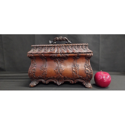 74 - Georgian Mahogany tea caddy with ornate carving to lid & body with lift out tray and 3 fixed compart... 