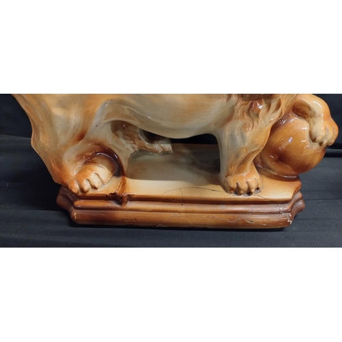 77 - Pair of Victorian Staffordshire ceramic fireplace lions. Measures approx H 27.5 x W 28.5 x D 13 cm b... 