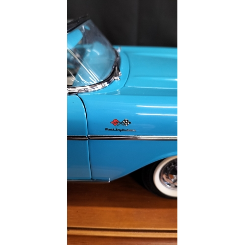 85 - Danbury Mint model of The 1957 Chevrolet Bel Air Convertible in Tropical Turquoise No 8 on wooden ba... 