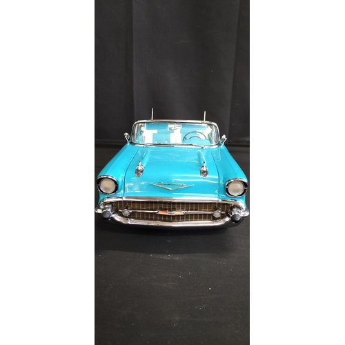 85 - Danbury Mint model of The 1957 Chevrolet Bel Air Convertible in Tropical Turquoise No 8 on wooden ba... 