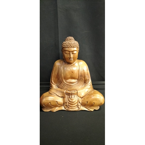 130 - Solid Wood carving of a Buddha seated. Measures approx H 25 x W 23.5 x D 14 cm