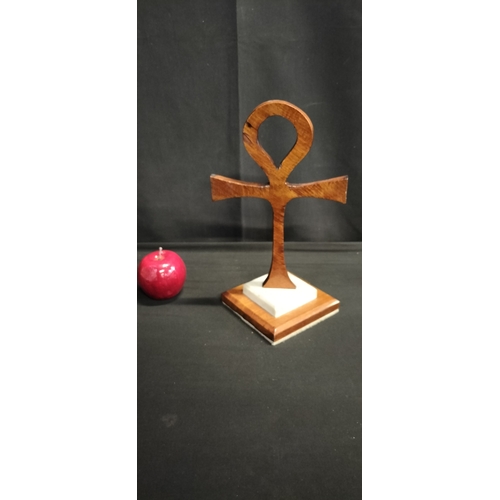 131 - Wooden Ankh Ornament on marble plinth set on wooden base with brass plaque and inscription 