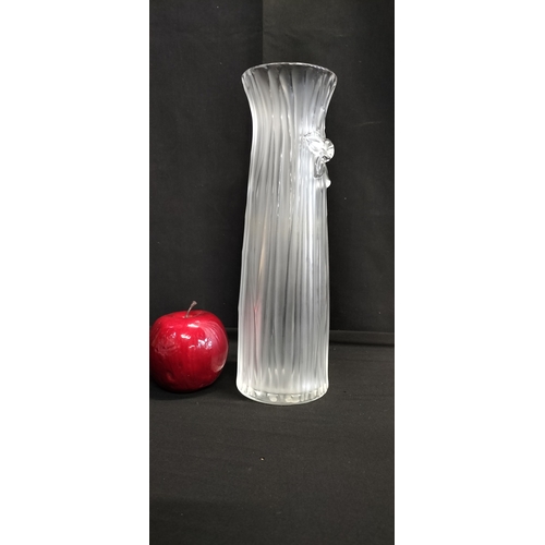 133 - Lalique tall vase in the daffodil design. Measures approx H 27 x W 8.5 cm