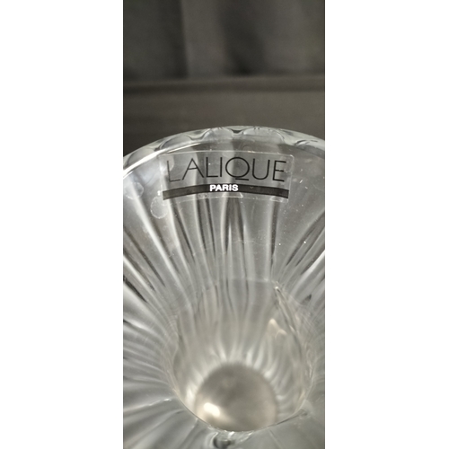 133 - Lalique tall vase in the daffodil design. Measures approx H 27 x W 8.5 cm