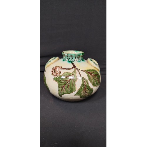 135 - Della- Robbia Co Ltd. 1896 Liza Wilkins, posey vase measures approx H 11 x W 6 in a leaf design