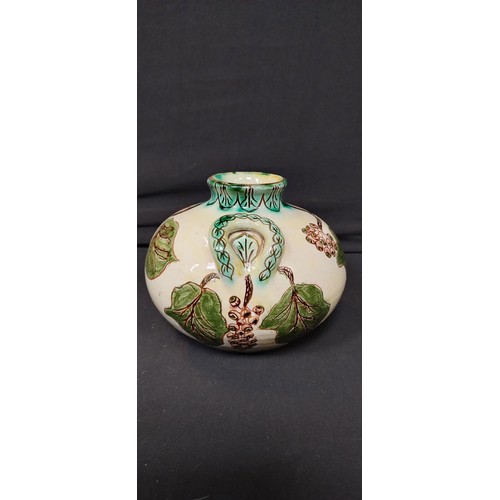 135 - Della- Robbia Co Ltd. 1896 Liza Wilkins, posey vase measures approx H 11 x W 6 in a leaf design