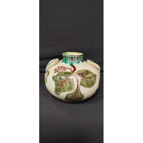 135 - Della- Robbia Co Ltd. 1896 Liza Wilkins, posey vase measures approx H 11 x W 6 in a leaf design