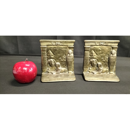 136 - Pair of cast metal Egyptian bookends features Sphinx, mummy and pyramid. Measures approx H 13.5 x W ... 