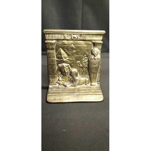 136 - Pair of cast metal Egyptian bookends features Sphinx, mummy and pyramid. Measures approx H 13.5 x W ... 