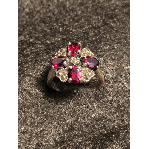 25 - Sterling silver ring set with garnet and marquisette. Size N/O