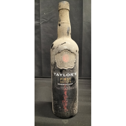 193 - Two bottles of unopened alcohol. A bottle of vin De Pays D'Aude Merlot and a bottle of Taylor's Firs... 