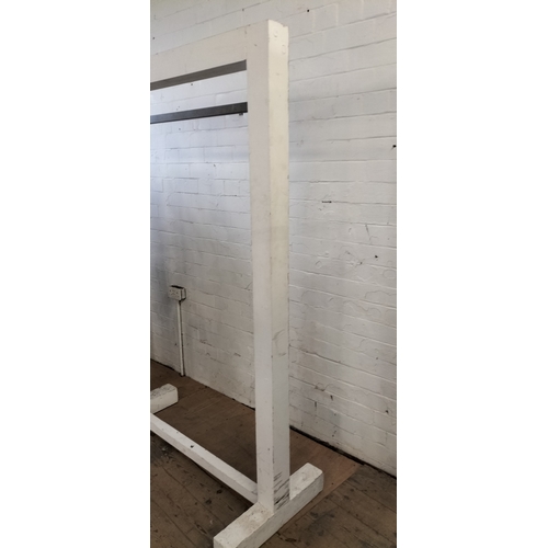 198 - Painted Solid wood Large clothes display rail. With metal hanging bar. Measures approx H 180.5 x W 1... 