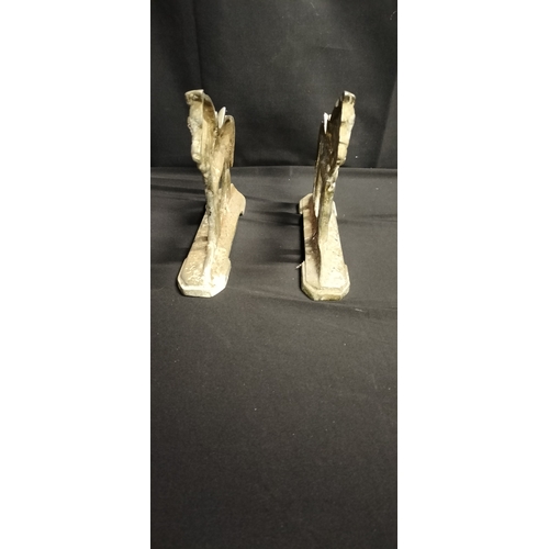 215 - Pair of cast metal horse door stops. Measures approx H 17 x W 20 x D 4.5 cm