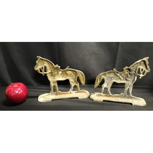 215 - Pair of cast metal horse door stops. Measures approx H 17 x W 20 x D 4.5 cm