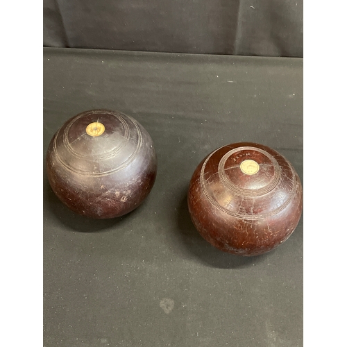 93 - Pair of vintage crown green bowling bowls