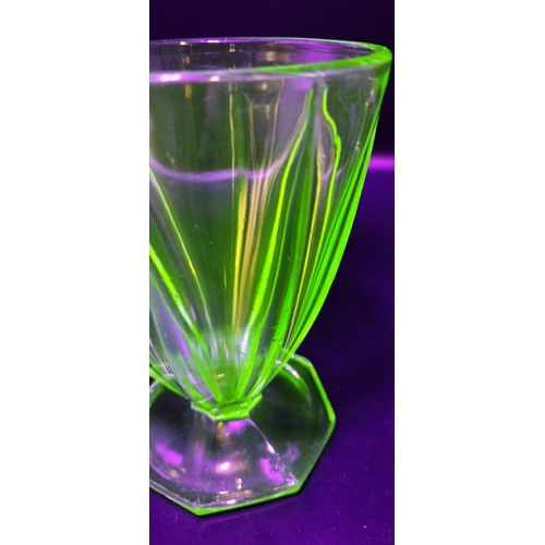 167 - Two art deco uranium glass glasses. Measures approx 12 x 9 cm