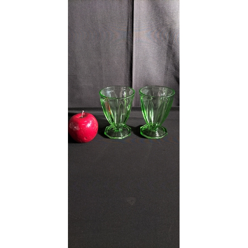 167 - Two art deco uranium glass glasses. Measures approx 12 x 9 cm