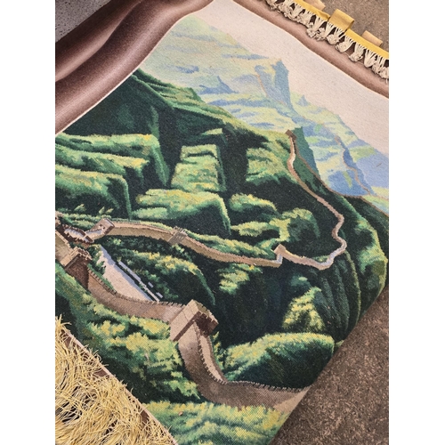 176 - Wall hanging rug picturing the image of the great wall of china. Measures approx 214 x 127cm