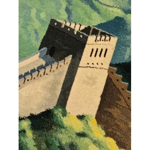 176 - Wall hanging rug picturing the image of the great wall of china. Measures approx 214 x 127cm