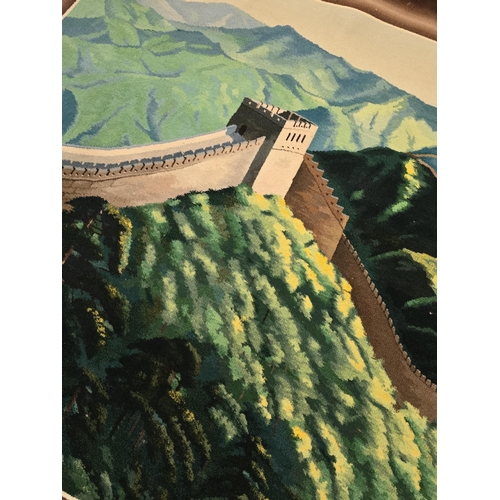 176 - Wall hanging rug picturing the image of the great wall of china. Measures approx 214 x 127cm