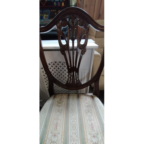 243 - Two mahogany Prince of Wales backed dining chairs