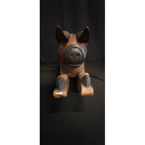 298 - Solid Wood carving of a rocking pig hand made in Thailand. Measures approx H 40 x 60 cm