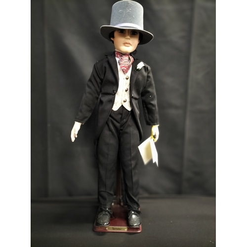 53 - Boxed Alberton Company Dominic doll on stand. Measures approx H 60.5 x 14 cm