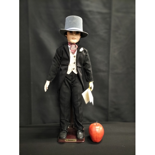 53 - Boxed Alberton Company Dominic doll on stand. Measures approx H 60.5 x 14 cm