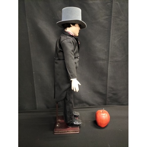 53 - Boxed Alberton Company Dominic doll on stand. Measures approx H 60.5 x 14 cm